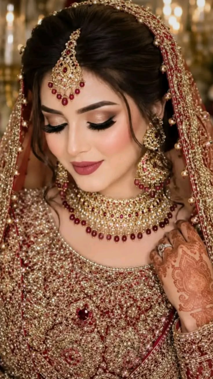 Maroon bridal makeup with maang tikka in Lucknow — HD bridal look by AAINA Salon