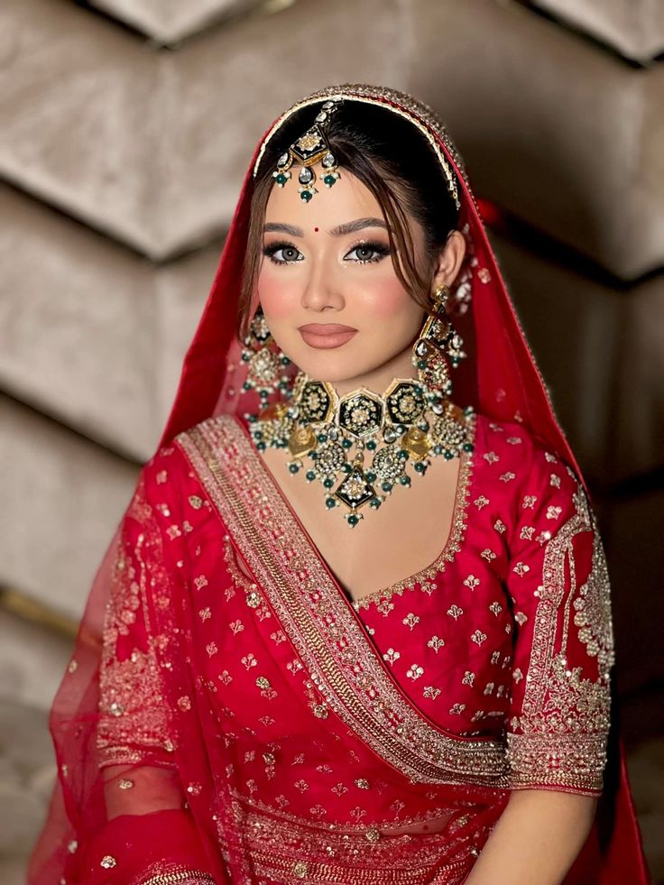 Red bridal makeup with polki choker in Lucknow — AAINA Salon bridal portfolio